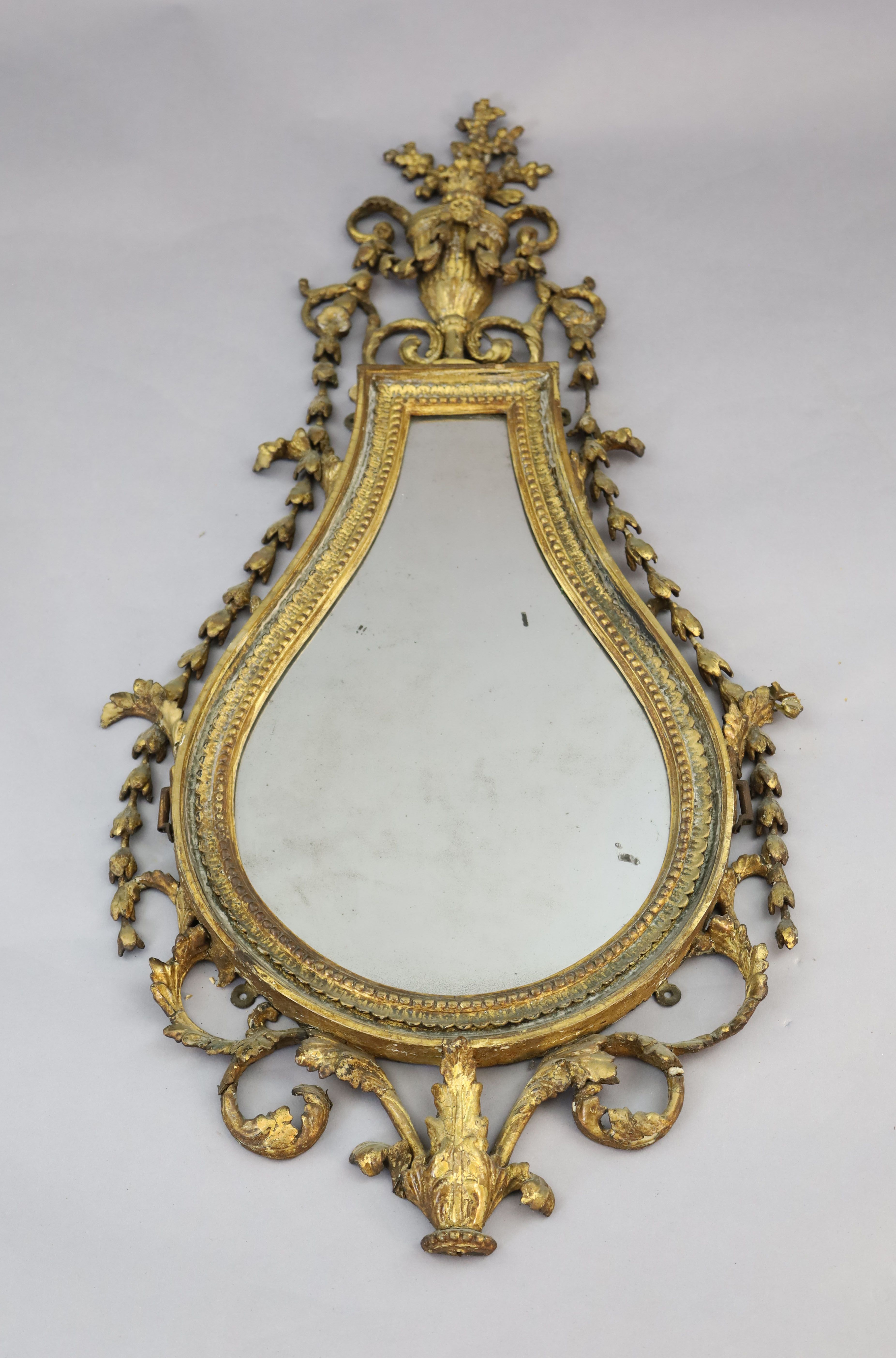 An early 19th century giltwood and gesso wall mirror, W.1ft 10in. H.3ft 9in.